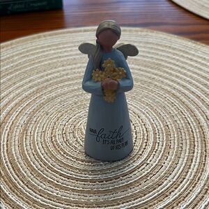 B. Lloyd Angel Figurine with Yellow Flowers